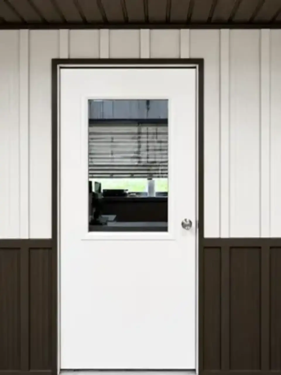 White door with window in it in a shop.
