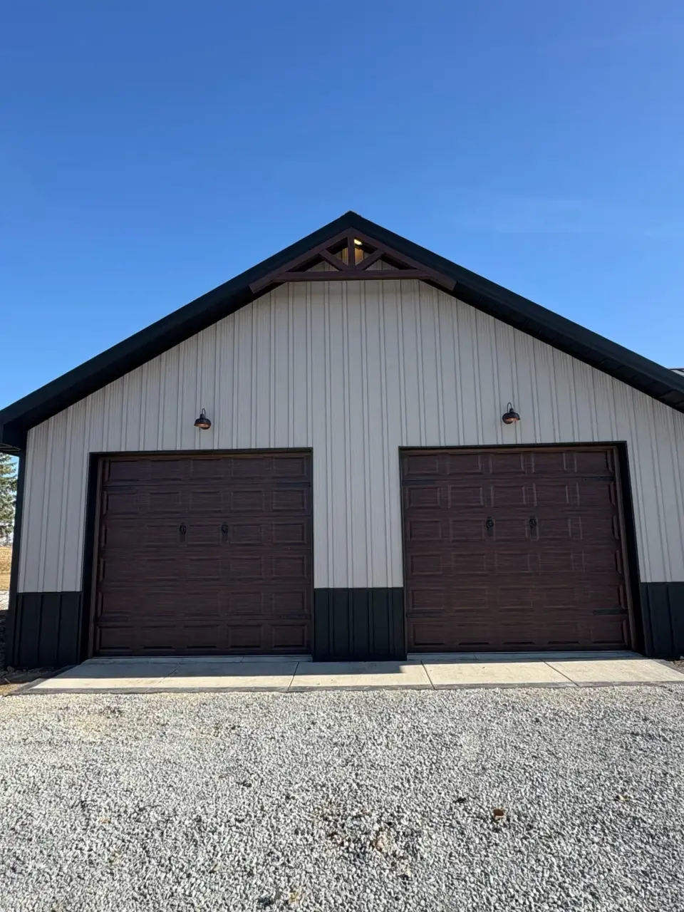Storage building with two overhead doors and metal siding