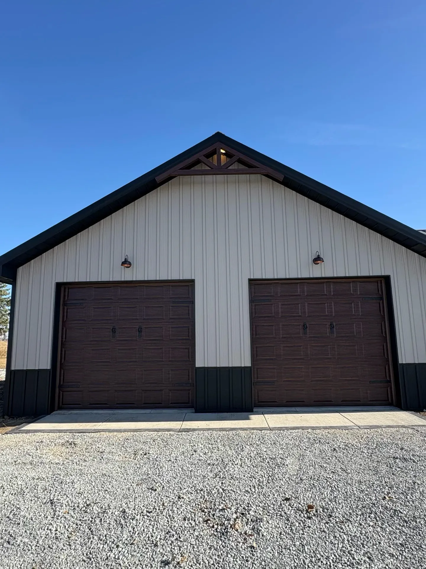 Storage building with two overhead doors and metal siding